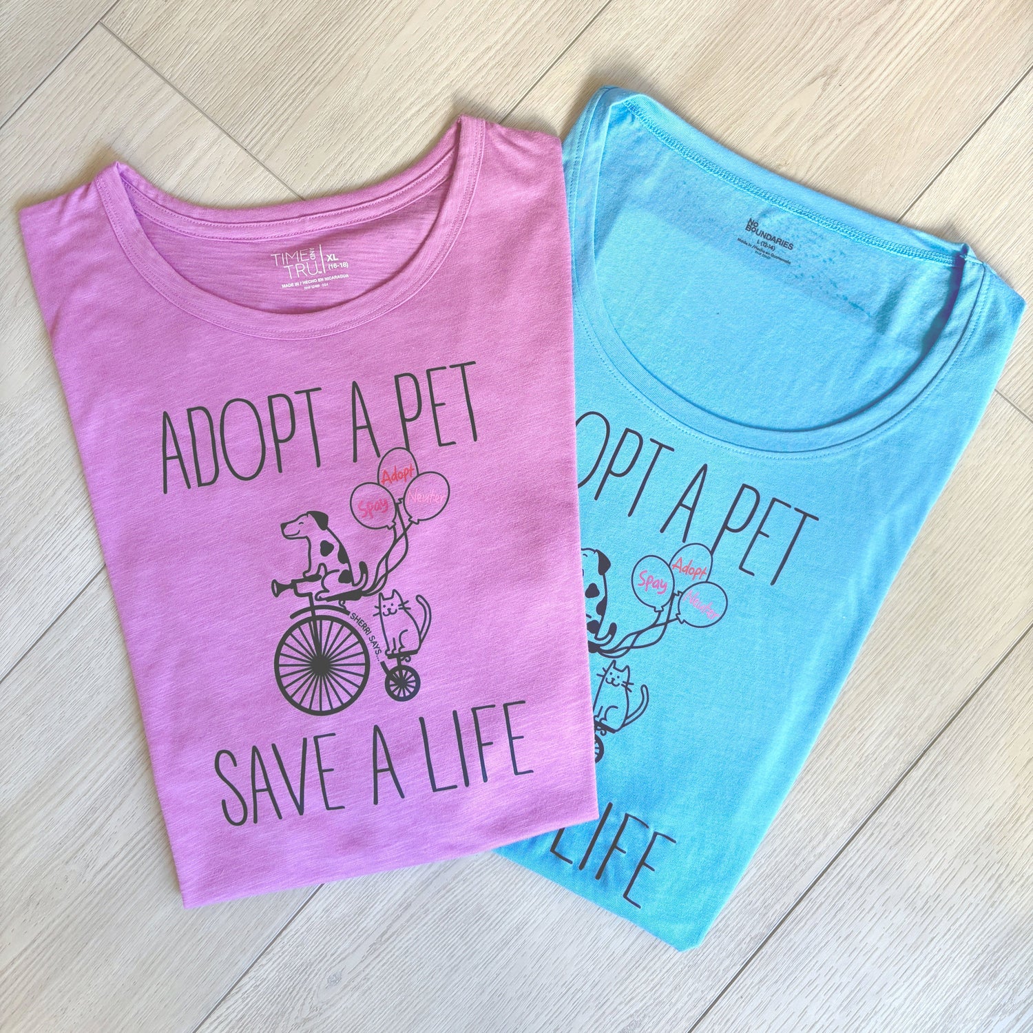 Pink and Blue Tshirts with Adopt A Pet Save a Life graphic on front